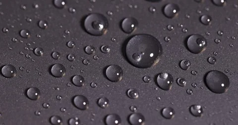 Plastic surface covered with water, closeup of the wet part of an object made of Stock Footage 314143711