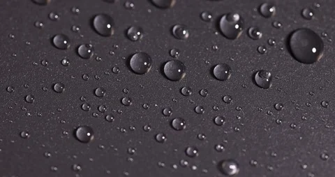 Plastic surface covered with water drops, details of the wet part of an object Stock Footage 315539764