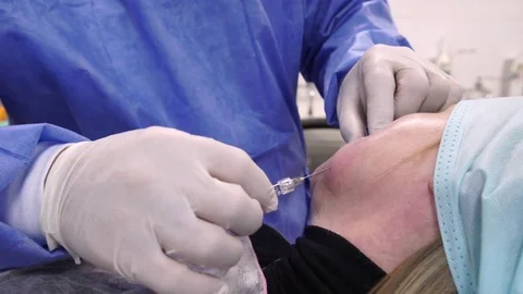 Plastic surgeon doing anti-aging injections Stock Footage 75447598