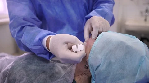 Plastic surgeon doing anti-aging injections Stock Footage 75447652