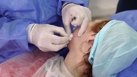 Plastic surgeon doing anti-aging injections Stock Footage 75448008