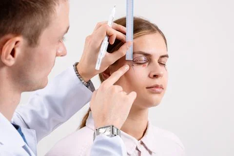 Plastic Surgeon Marks and Measures Eyelids for Blepharoplasty Eye Shape Cor.. Stock Photos