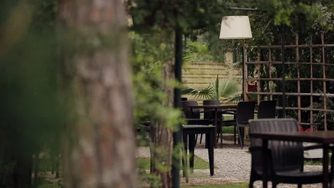 Plastic tables and chairs on a summer area in the cafe. Stock Footage 100892504