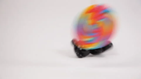 Plastic Teddy Bear being hypnotized by a candy Stock Footage 141231583