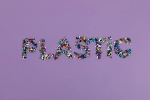 Plastic text consisting of small recycled plastic pellets collected from the 스톡 사진