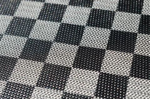 Plastic texture in the form of a very small cloth binding, painted in black a Stock Photos