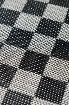 Plastic texture in the form of a very small cloth binding, painted in black a Stock Photos