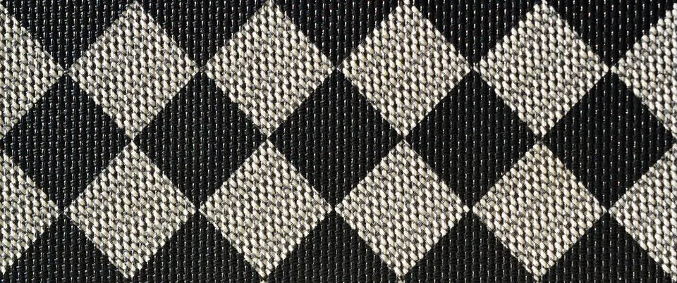 Plastic texture in the form of a very small cloth binding, painted in black a Stock Photos