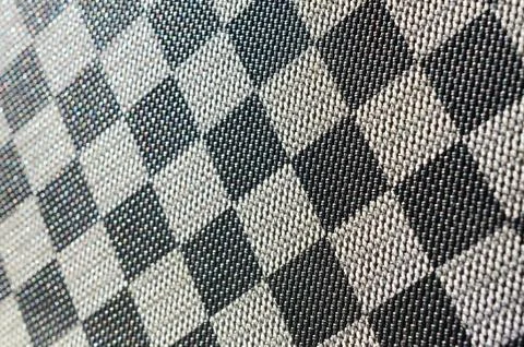Plastic texture in the form of a very small cloth binding, painted in black a Stock Photos