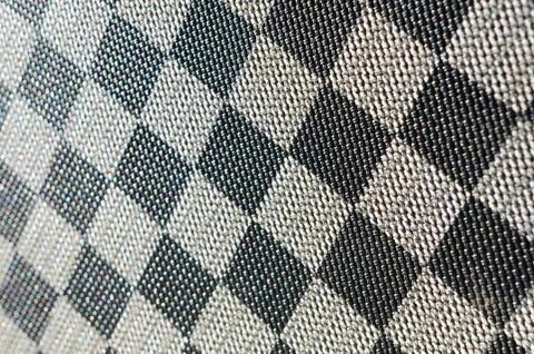 Plastic texture in the form of a very small cloth binding, painted in black a Stock Photos