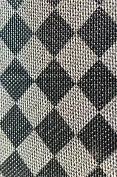 Plastic texture in the form of a very small cloth binding, painted in black a Stock Photos