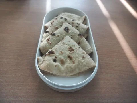 A plastic tiffin decorated with bread for dinner Stock Photos