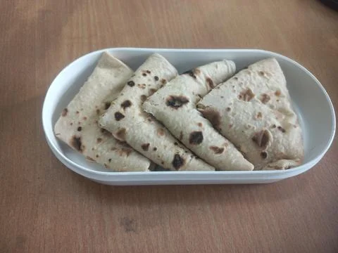 A plastic tiffin decorated with bread for dinner Stock Photos