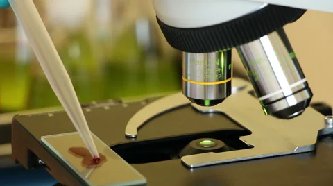 Plastic tip touches the drop of blood close up Stock Footage 63045846