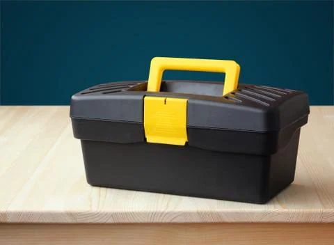 Plastic tool box against a blue wall. Workshop. Foto stock