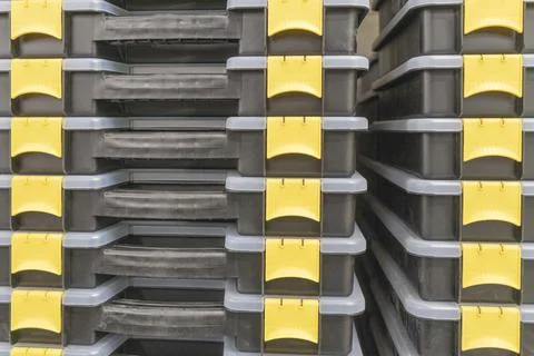 Plastic tool boxes stacked like a backdrop Stock Photos