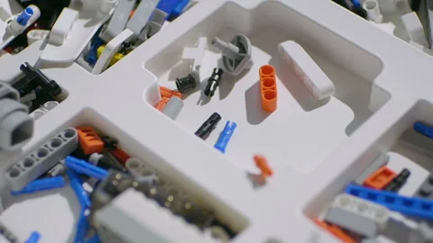 Plastic toy blocks falling into the box. Slow motion Stock Footage 150377344