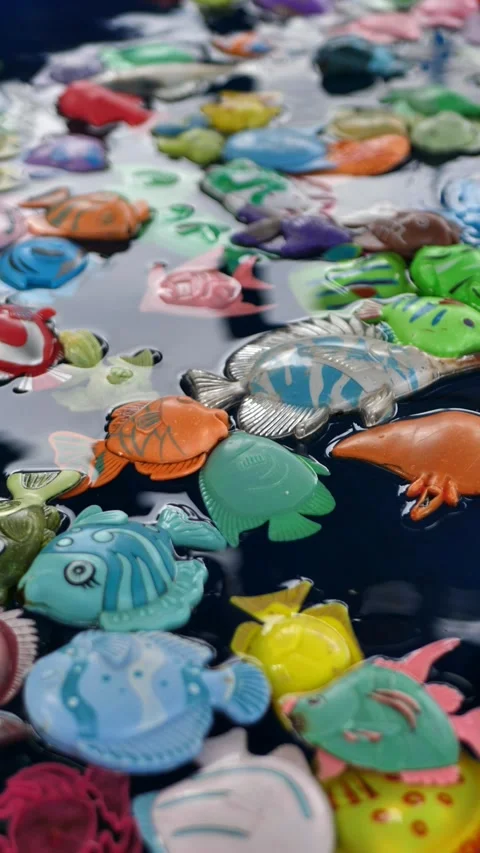 Plastic toy fish with magnet in the pool. Magnetic fishing toys, toys for kids Stock Footage 289387161