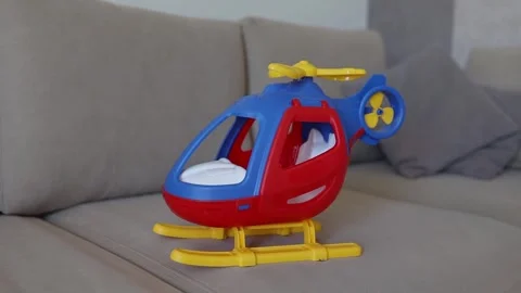 Plastic toy helicopter shown close up, with colorful body and detailed shape Stock Footage 315507697