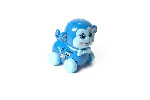 Plastic toy monkey on a white background. Stock Photos