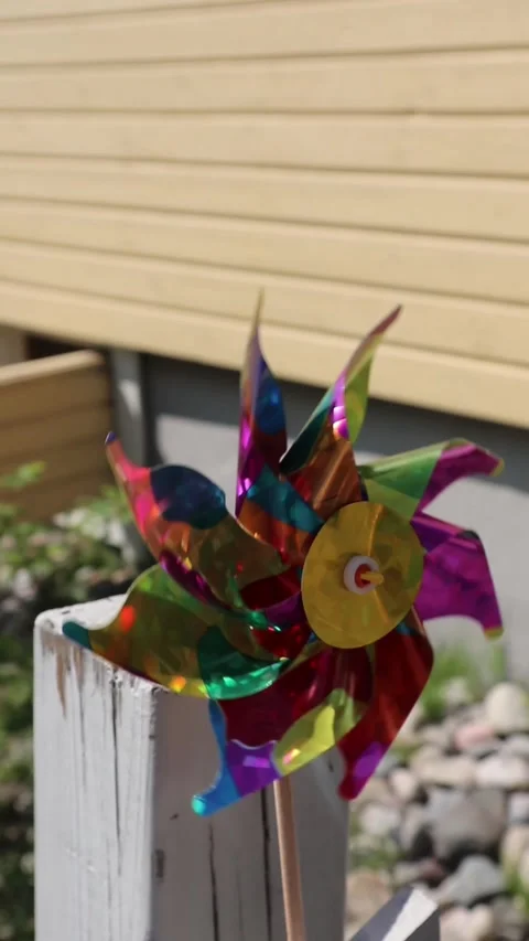 Plastic toy pinwheels rotating in wind Stock Footage 311439012