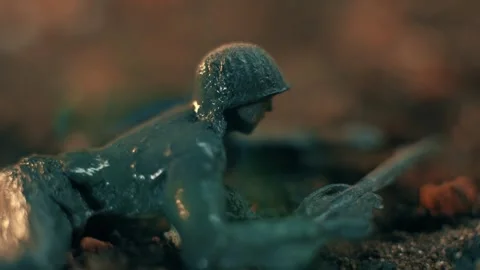 Plastic toy soldier melting in fire close up Stock Footage 333344142