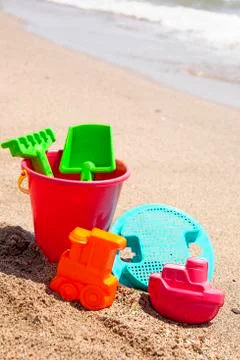 Plastic toys on the beach Stock Photos