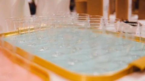Plastic transparent cups for liquid shallow focus . Preparation of glasses fo Stock Photos