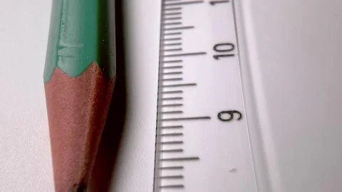Plastic transparent ruler and wooden slate pencil on a white table. Stock Footage 223187853