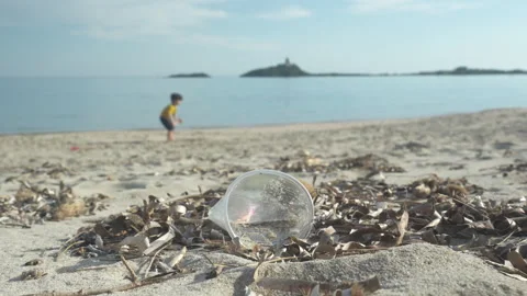 Plastic trash abandoned on the beach Stock Footage 270962951