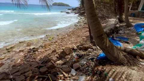 Plastic trash on the beach Видео 130071304