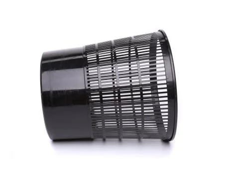 A plastic trash can lying on its side Stock Photos