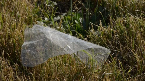 Plastic trash in the fields Stock Footage 112777973