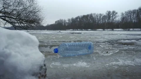Plastic trash on ice. The plastic waste problem is very strong Stock Footage 146605826