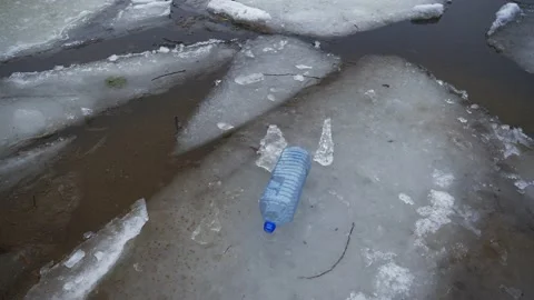 Plastic trash on ice. The plastic waste problem is very strong Video stock 146605834