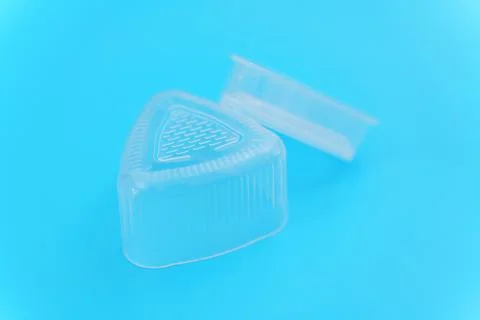 Plastic Triangular Onigiri Molds on a blue background 스톡 사진