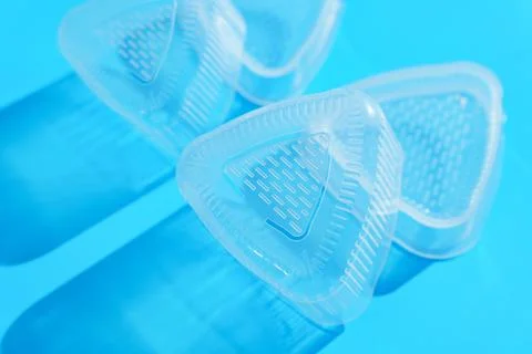 Plastic Triangular Onigiri Molds on a blue background Stock Photos