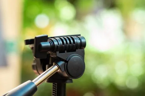 Plastic tripod camera mount head with a fast detach plate and a metal handle Stock Photos