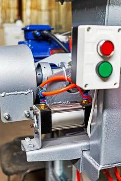 Plastic tubes of the pneumatic system connected to the pneumatic cylinder Stock Photos