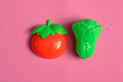Plastic vegetable collection set of tomato and lettuce on isolated white back Stock Photos