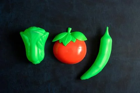 Plastic vegetable collection set of tomato, chili and lettuce on isolated whi Foto stock