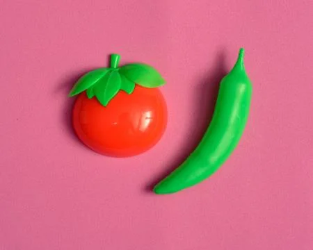 Plastic vegetable collection set of tomato and chili on isolated white backgr Stock Photos