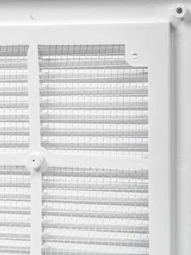 Plastic ventilation grate close-up. Back side with mesh. Color is white. Stock Photos