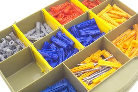 Plastic wall anchor in a transparent plastic box Stock Photos