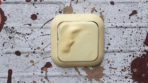The plastic wall light switch on the wall lights up and melts. There was a short Stock Footage 153796084
