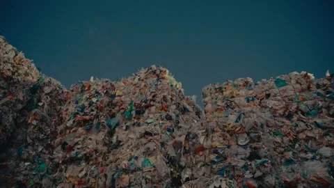 Plastic Waste Bales Stacked High Inside a Large Industrial Sorting Facility Stock Footage 331166613
