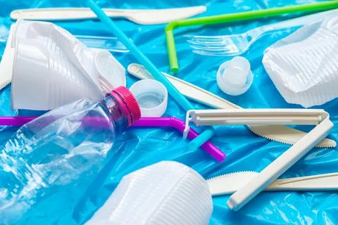 Plastic waste, on blue plastic surface Stock Photos