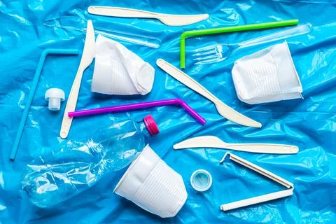 Plastic waste, on blue plastic surface Stock Photos
