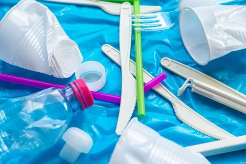 Plastic waste, on blue plastic surface Stock Photos