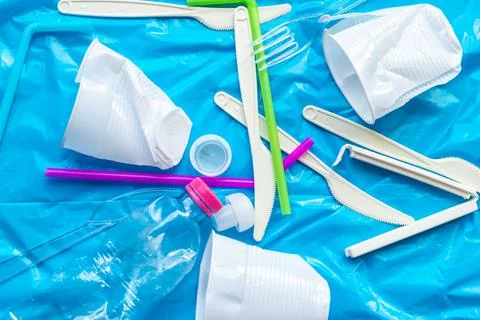 Plastic waste, on blue plastic surface Stock Photos